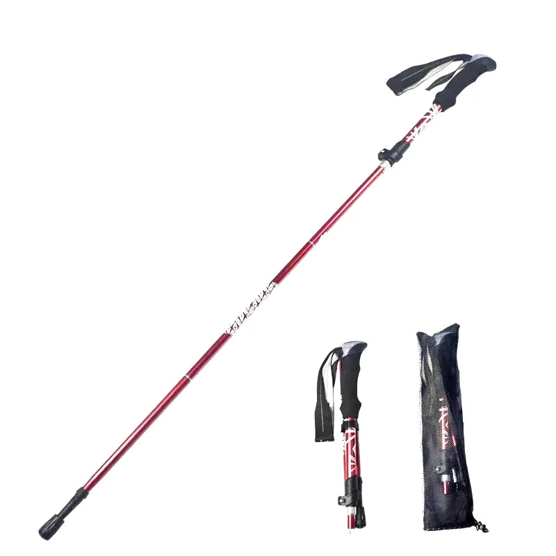 Red and black collapsible hiking pole with a textured grip, featuring the brand name ’kolle’ printed along its shaft