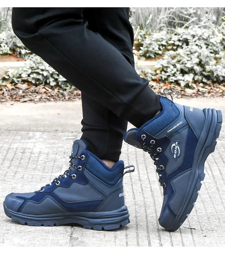 Navy blue and dark gray high-top hiking boots with reinforced stitching, laces, and a rugged rubber sole