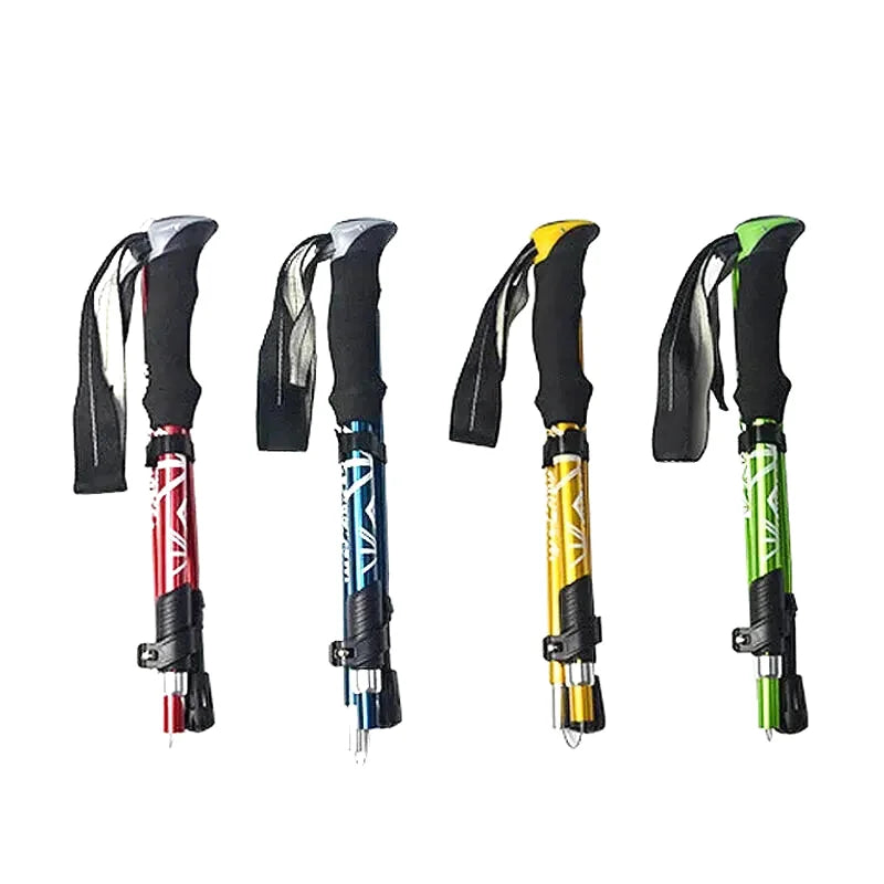 Four collapsible trekking poles in red, blue, yellow, and green with black ergonomic grips and adjustable sections